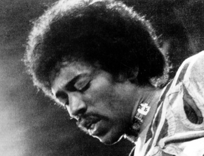 In this 1970 file photo, Jimi Hendrix performs on the Isle of Wight in England. A new Jimi Hendrix album is coming March 5. The musician's website says “People, Hell and Angels” contains 12 previously unreleased tracks recorded in 1968 and '69. Rolling Stone revealed the album cover on its website Wednesday, Nov. 21, 2012.(AP Photo/file)